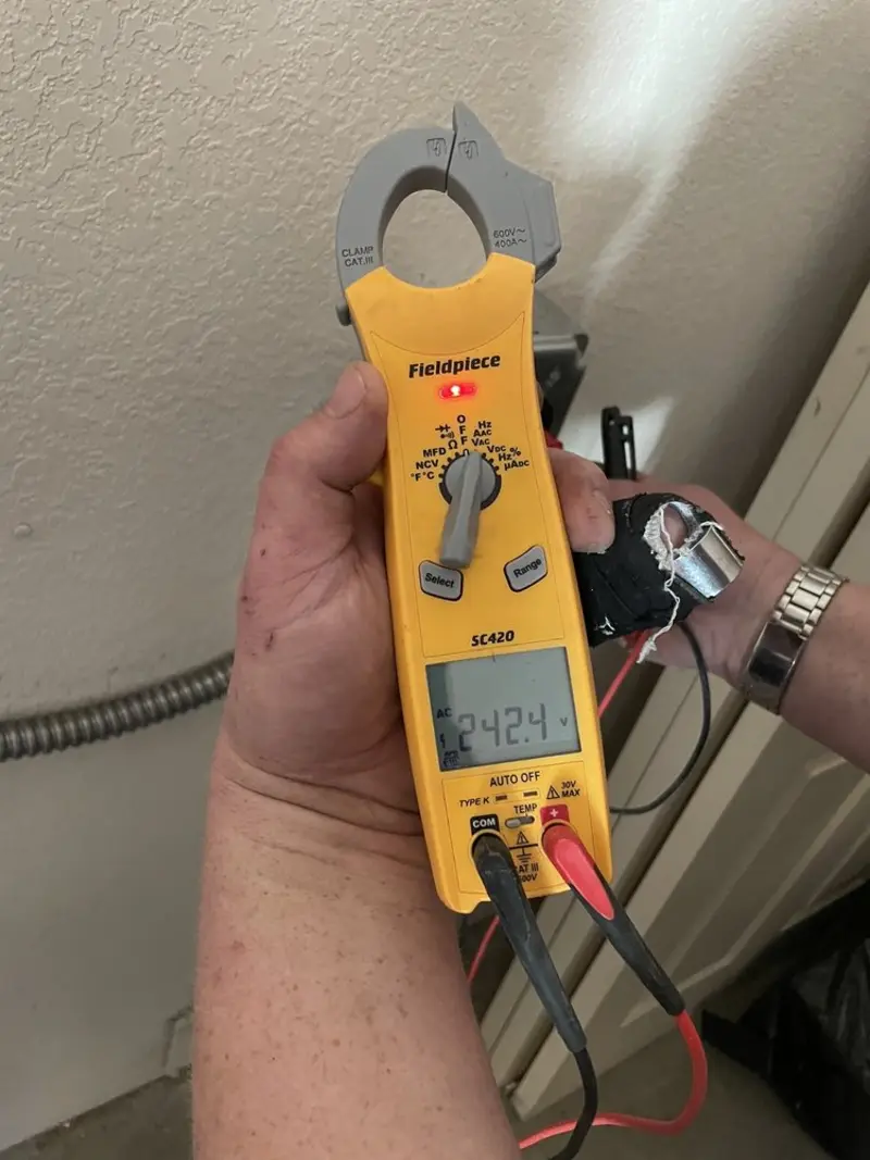 Voltage testing with clamp meter during Ceiling Fan Installation in Yorkville